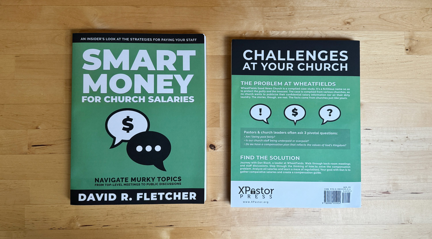 Front and back of the Smart Money book on a wooden table.